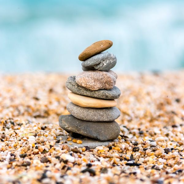 Balanced stones stacked on top of each other, symbolizing harmony and stability.